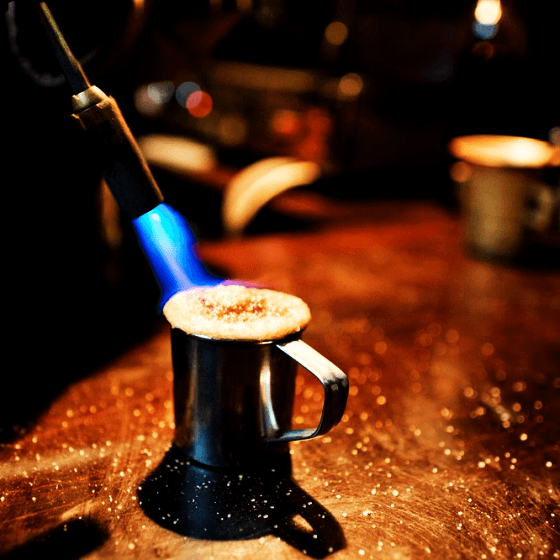 a flaming coffee prepared with a blowtorch in lviv coffee mine