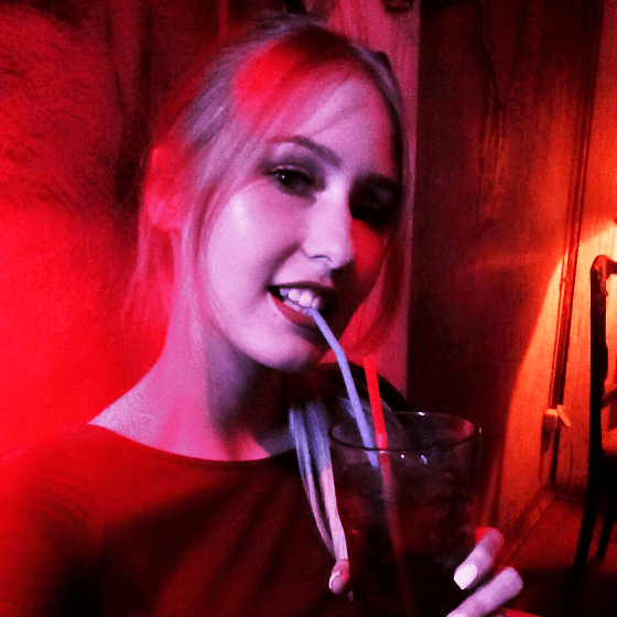 a ukrainian girl sippimg a cocktail in masoch cafe lviv