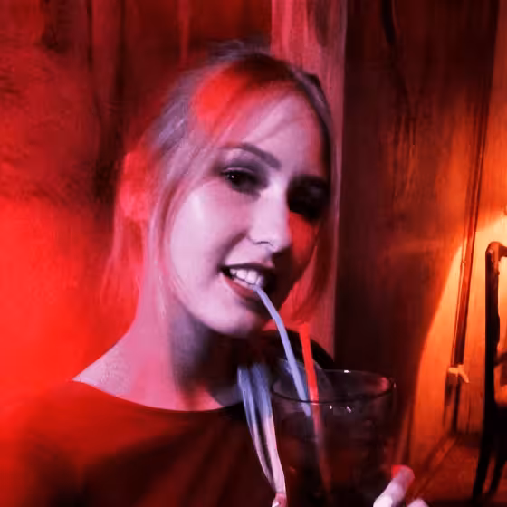 a ukrainian girl sippimg a cocktail in masoch cafe lviv