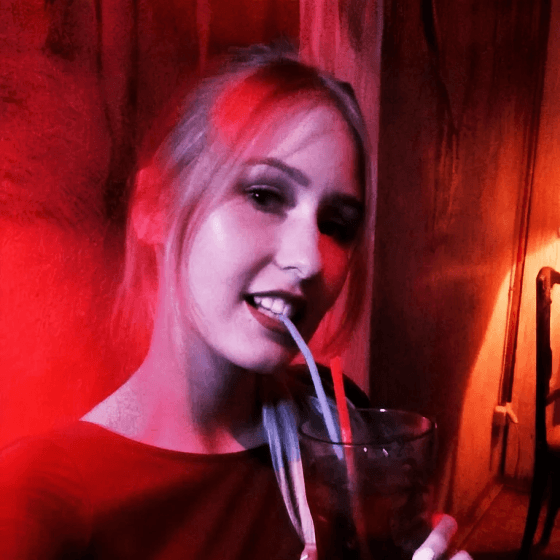 a ukrainian girl sippimg a cocktail in masoch cafe lviv